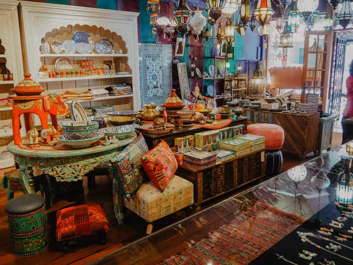 A store filled with Moroccan cushions, bowls and knick knacks.